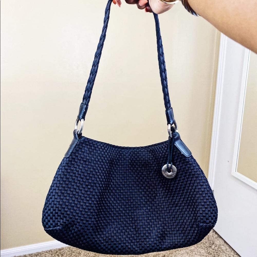 Black woven satchel bag by The Sak